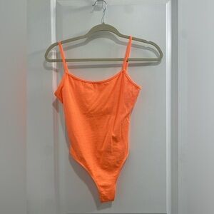 Super cute super SOFT and stretchy bodysuit. Mush more neon then in the picture